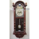 A modern beech and mahogany cased regulator; the movement faced by a painted Roman dial  34"h  12.