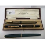 Three fountain pens: to include a Swan trademark self filling pen  cased