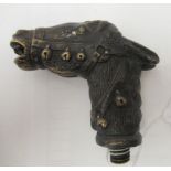 A cast and patinated bronze walking cane terminal, fashioned as a brindled donkey's head