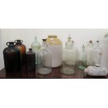 A collection of 20thC clear and coloured glass apothecary jars, some with branded labels and