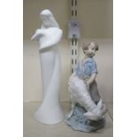 A Nao porcelain figure, a young boy standing beside a ram  8"h; and a Royal Doulton china figure '