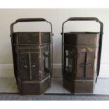 A pair of lacquered brass lanterns, fashioned as Tilley Food carriers/warmers with glazed sides