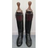 A pair of pre-1950s hide, military riding boots with wooden shoe lasts  11"L