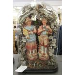 A pair of late 19thC Continental porcelain figures, figures beneath an arbour of porcelain and