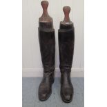 A pair of pre-1950s hide, military riding boots with wooden shoe lasts  11.25"L