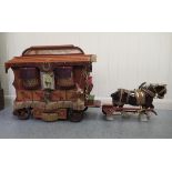 A 20thC scratch built horsedrawn, model Romany caravan with stud, brass, tasselled and overpainted
