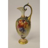 A Royal Worcester blush ivory glazed and gilded china ewer of ovoid form, having a narrow neck,