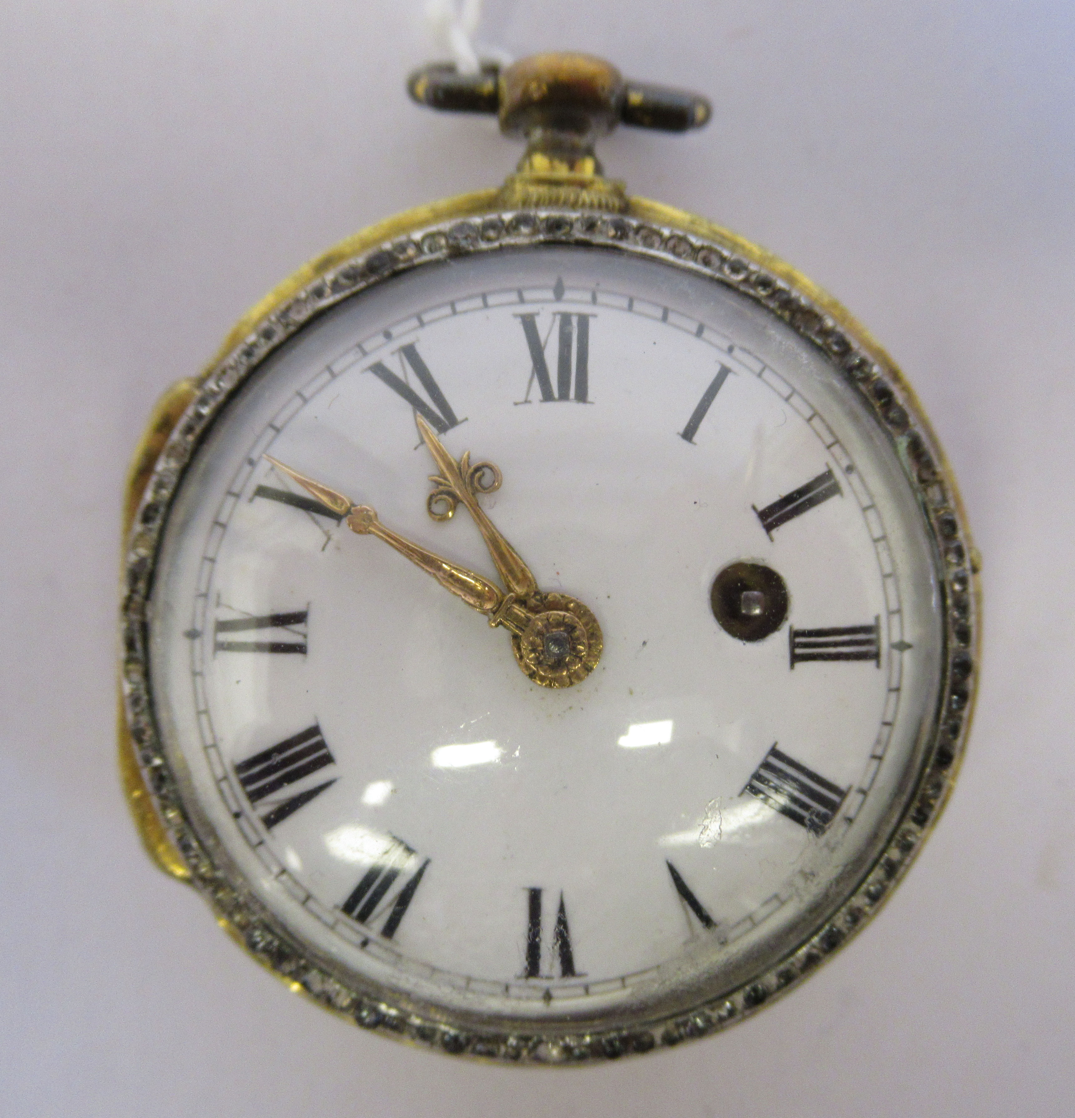 A lady's 19thC French gilt metal cased pocket watch with cast and engine turned decoration and a