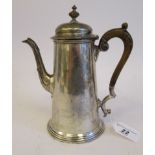 A Georgian style silver coffee pot of tapered form with an S-shaped spout, hinged domed lid, finial,