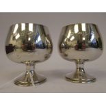 A pair of silver brandy balloon design pedestal goblets with gilt interiors  A.T Cannon