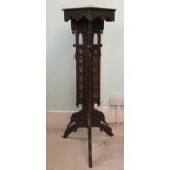 A late 19thC Anglo-Indian profusely floral carved and decoratively pierced hardwood torchere, the