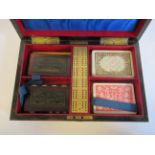 A late Victorian coromandel veneered games compendium, the shallow box enclosed by a lockable hinged