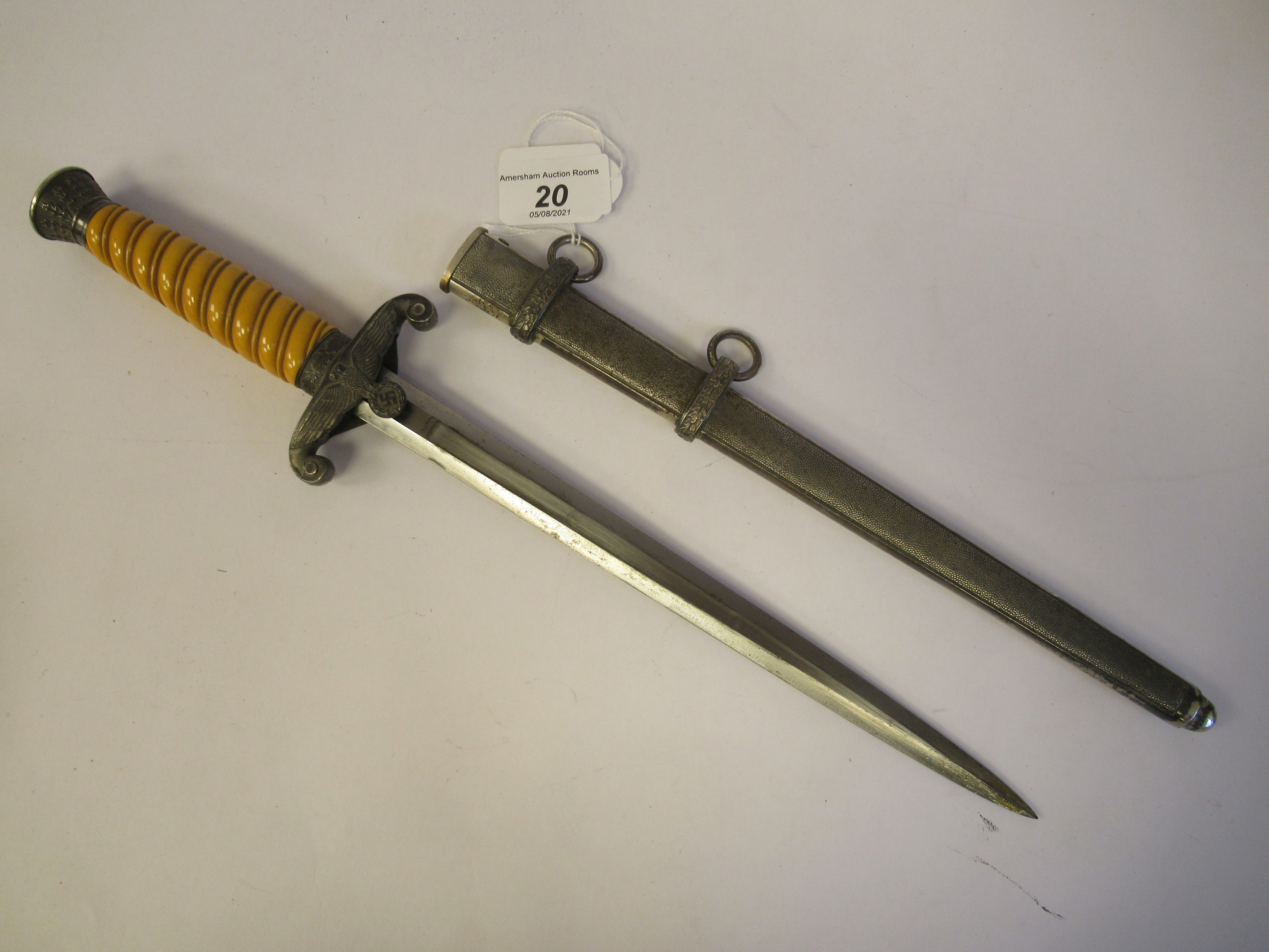 A German Third Reich officer's dress dagger with oakleaf ornament, a ribbed orange phenol handgrip