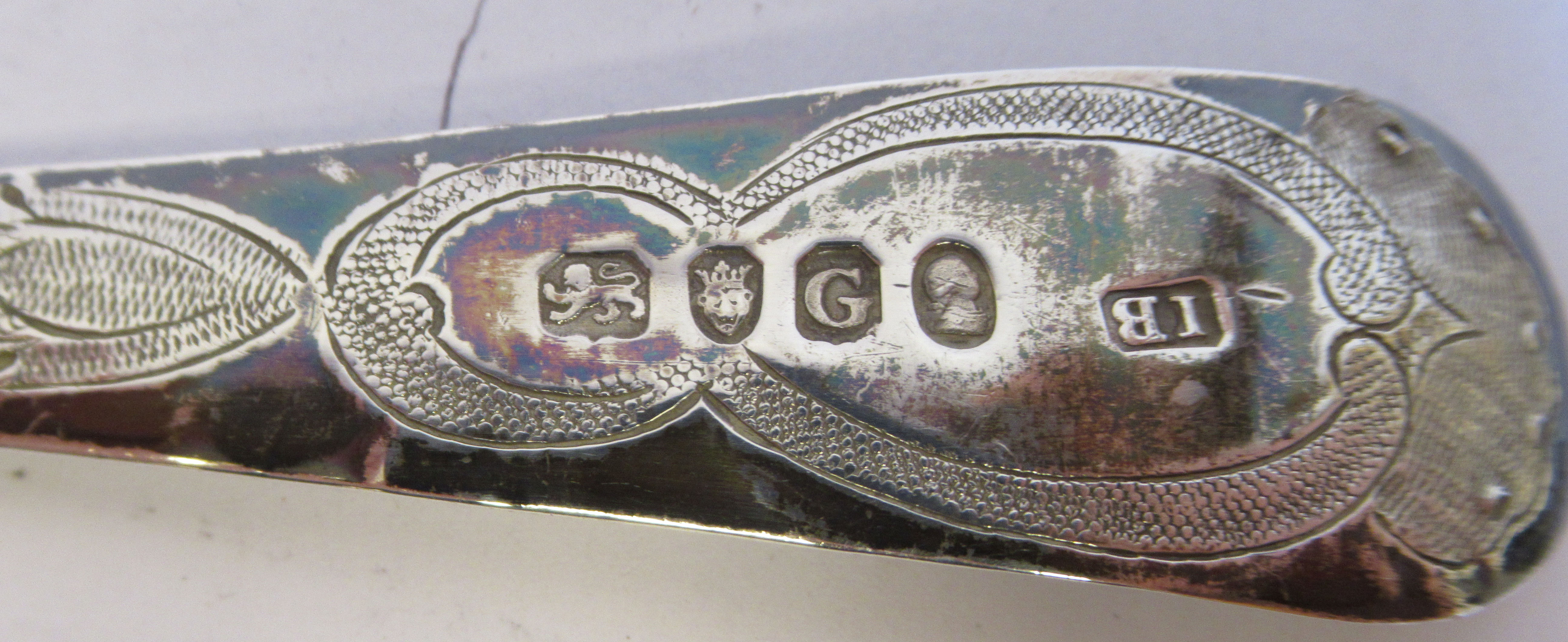 A pair of George III silver Old English pattern berry spoons with impressed, engraved and chased - Image 4 of 4