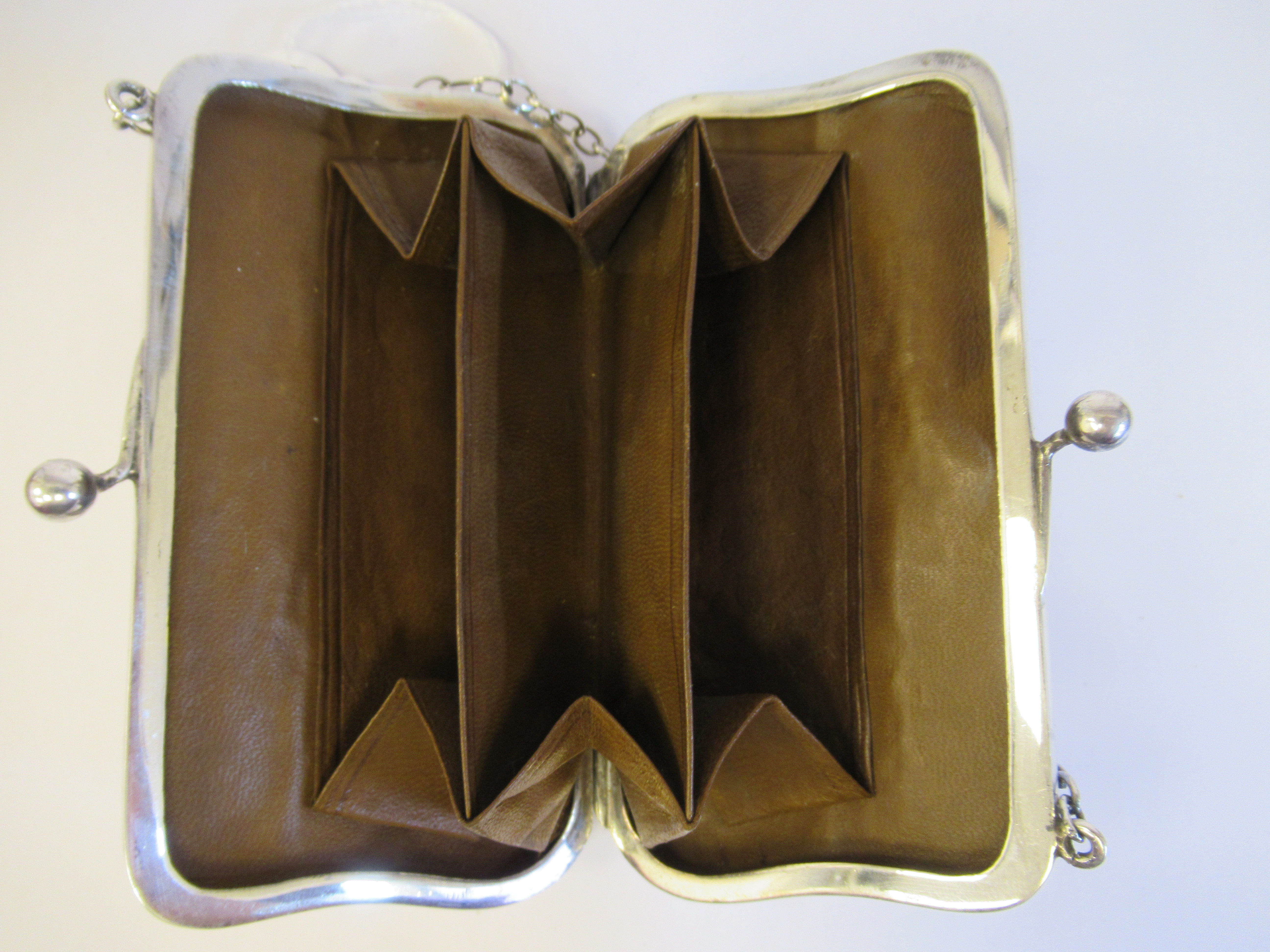 A silver purse, fashioned as a lady's handbag with a chain carrying handle and a cast vitruvian - Image 4 of 5