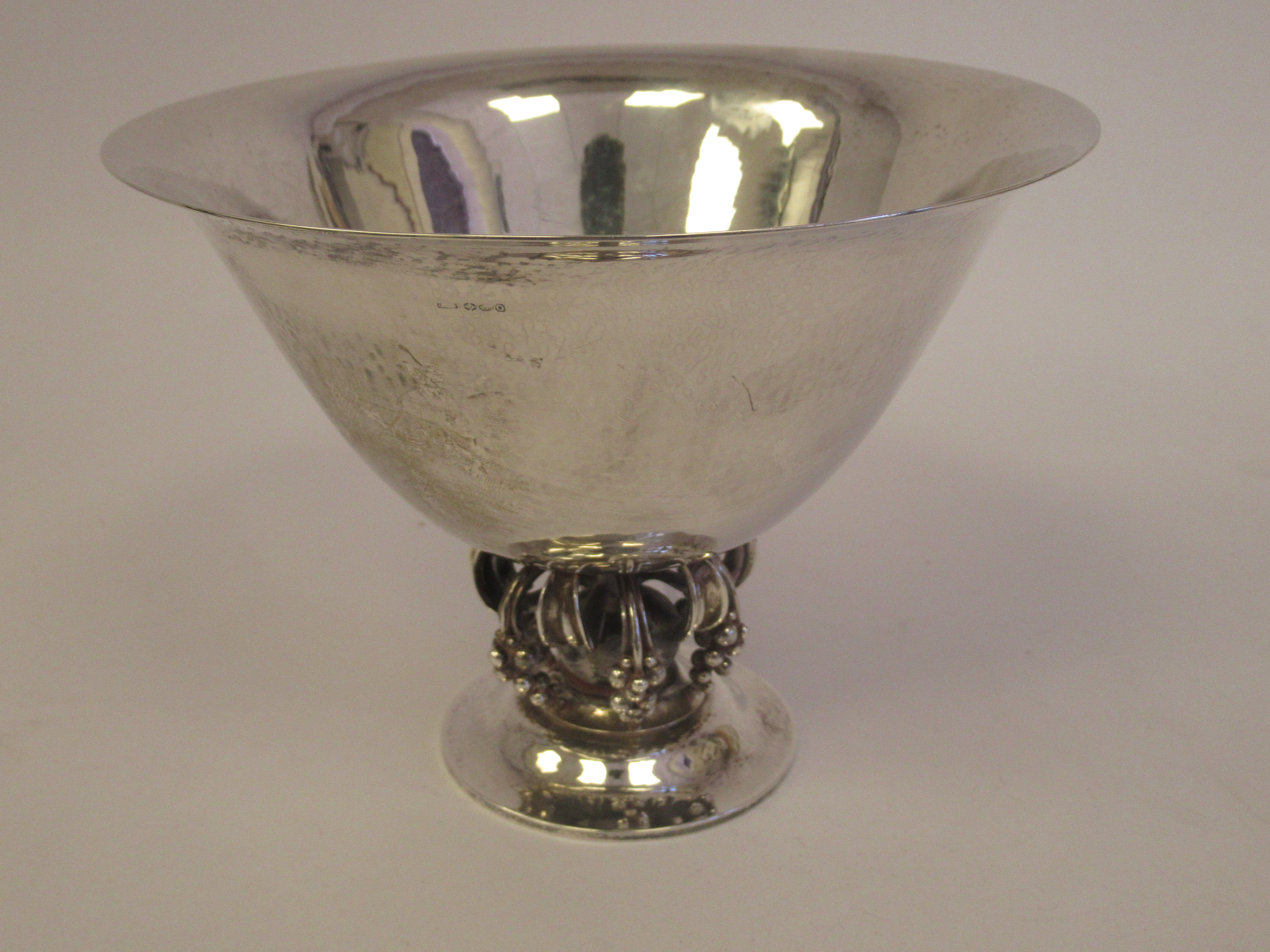 A 1950s Georg Jensen spot-hammered silver bowl, no.775, having wide, flared sides, elevated on short - Image 2 of 8