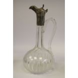 A mid Victorian slice and facet cut glass claret jug of squat, bulbous form with a long, narrow