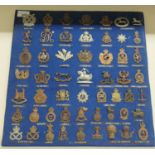 Approx. fifty military cap badges and other insignia, some copies: to include The Lancashire