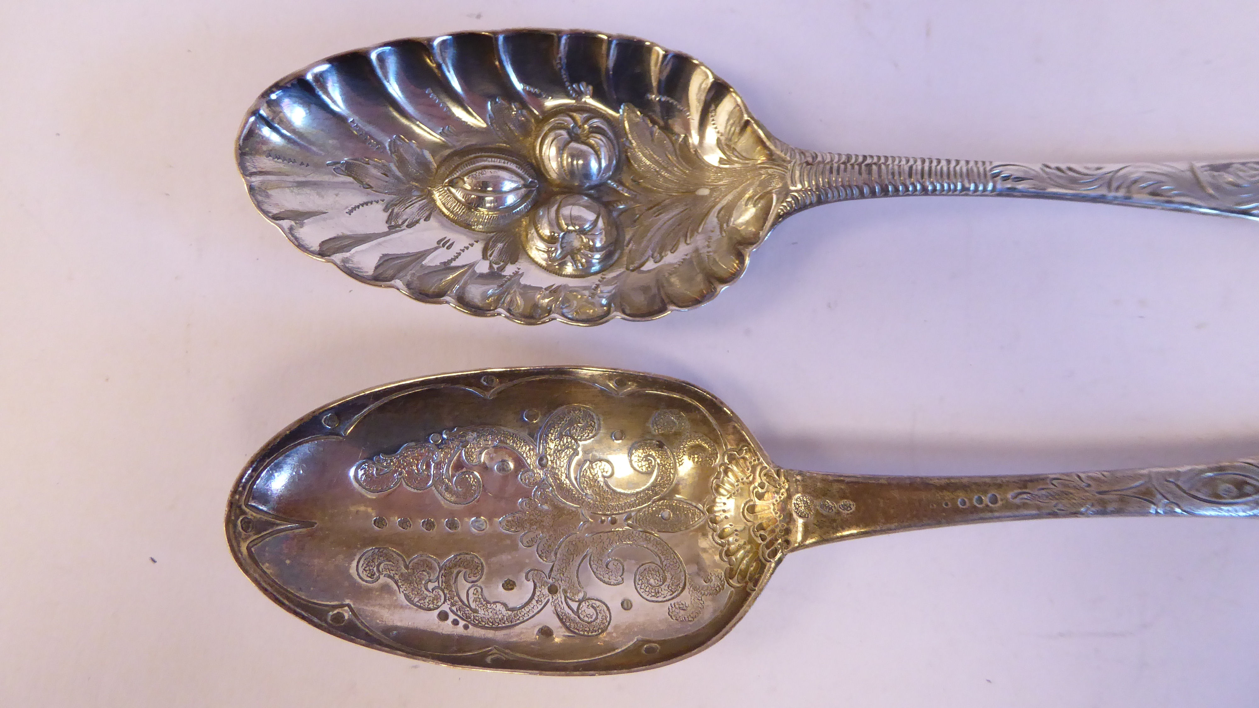 Four similar late 18th/early 19thC variously decorated, silver berry spoons  mixed marks - Image 3 of 5