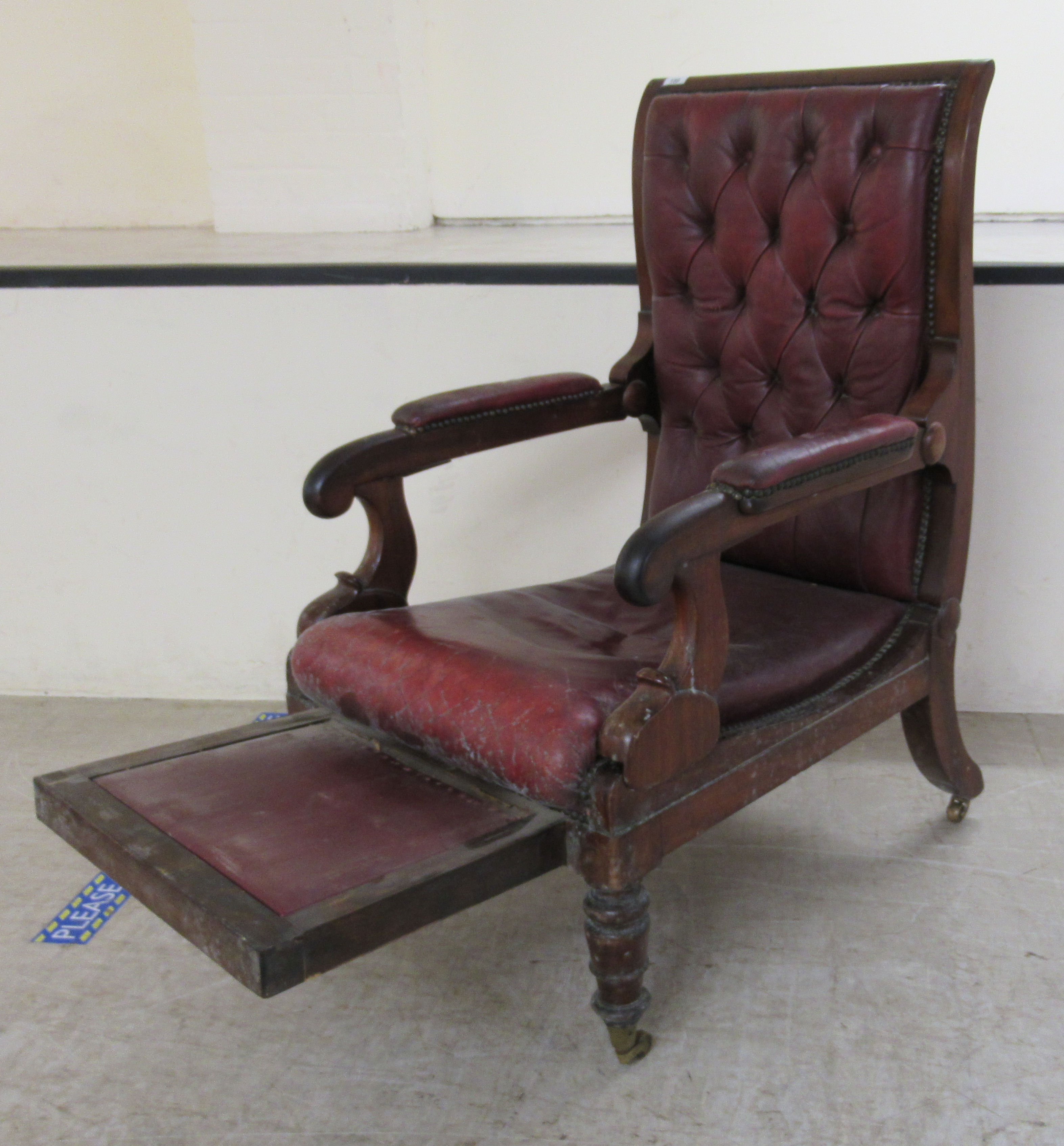 A William IV mahogany framed reclining library chair, the Daws Patent action having a height