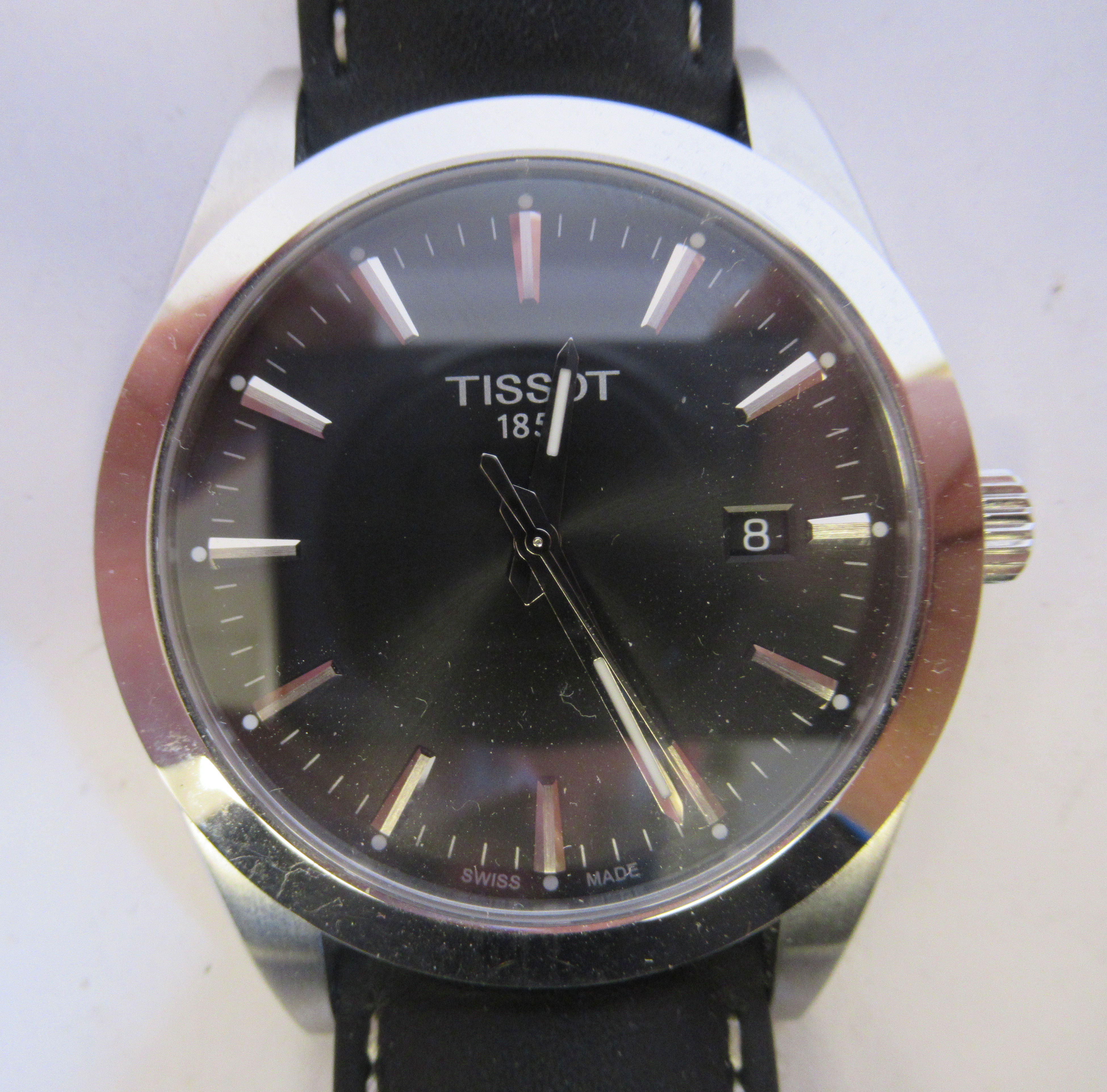 A Tissot 1853 stainless steel cased wristwatch, the movement with sweeping seconds, faced by a black