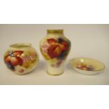 Three dissimilar pieces of Royal Worcester gilded, blush ivory glazed china, decorated by Kitty