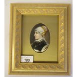 A late 19thC framed painted porcelain oval head and shoulders profile portrait miniature, a young