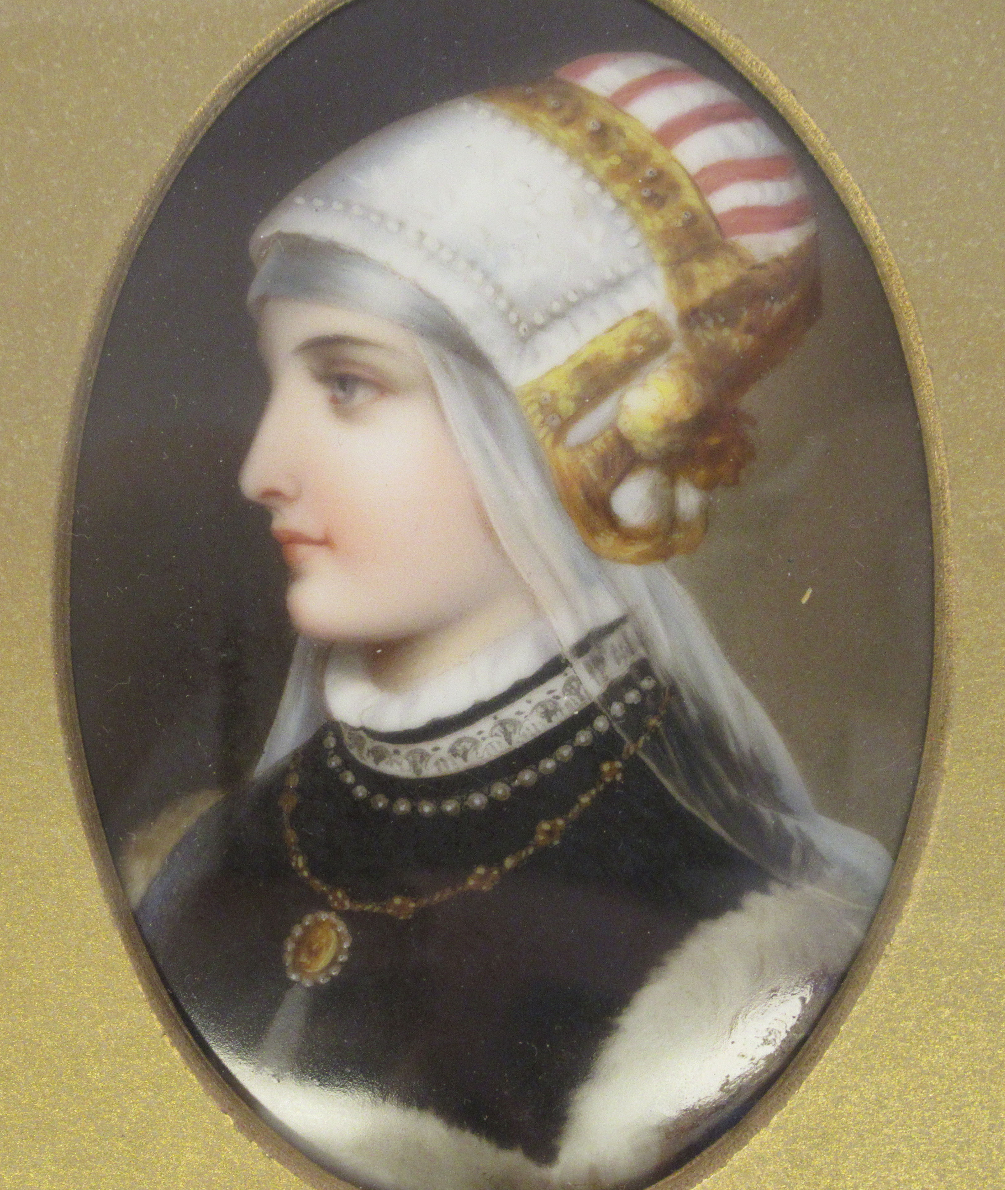 A late 19thC framed painted porcelain oval head and shoulders profile portrait miniature, a young - Image 3 of 5