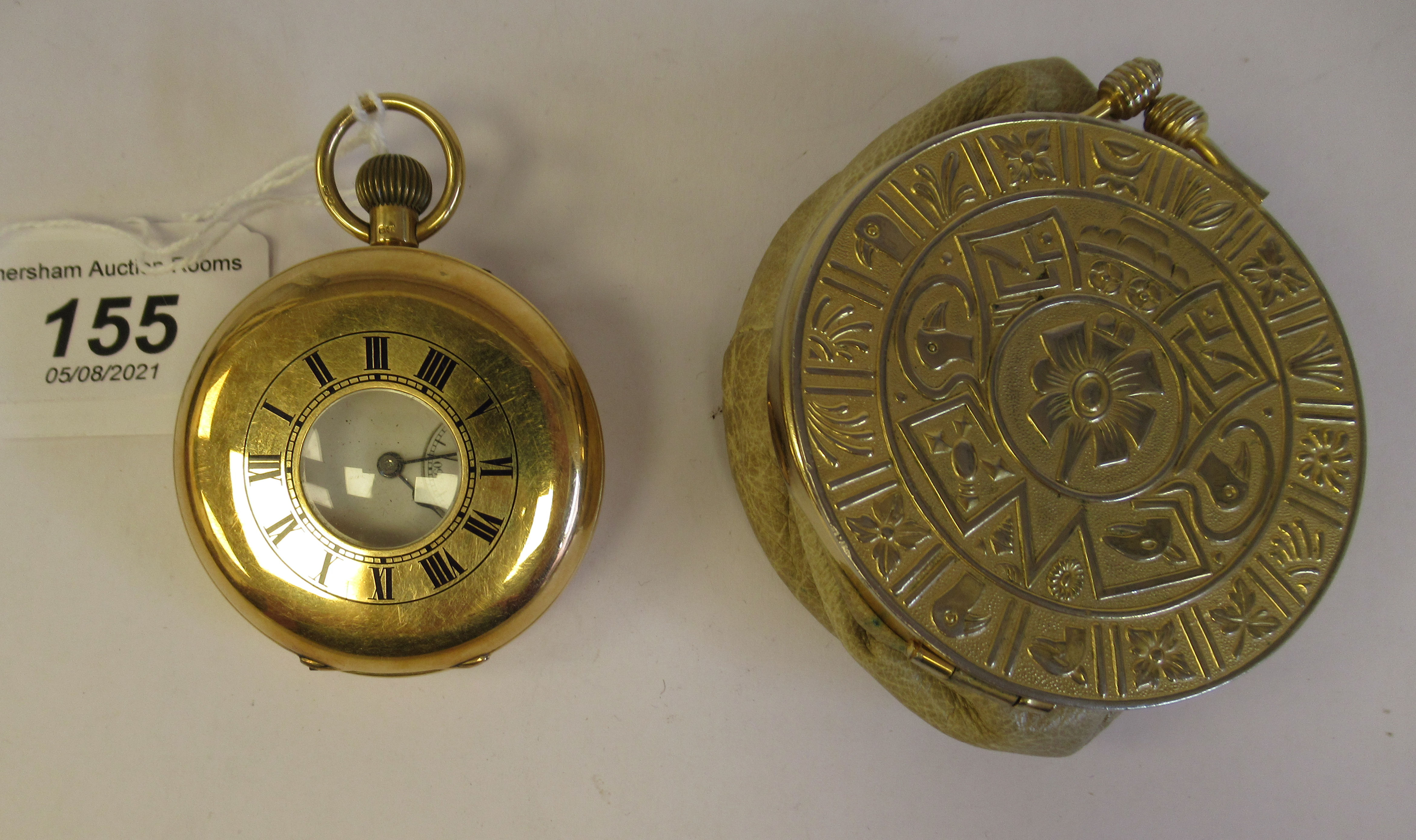 An 18ct gold cased half hunter pocket watch with black enamel Roman numerals around the window,