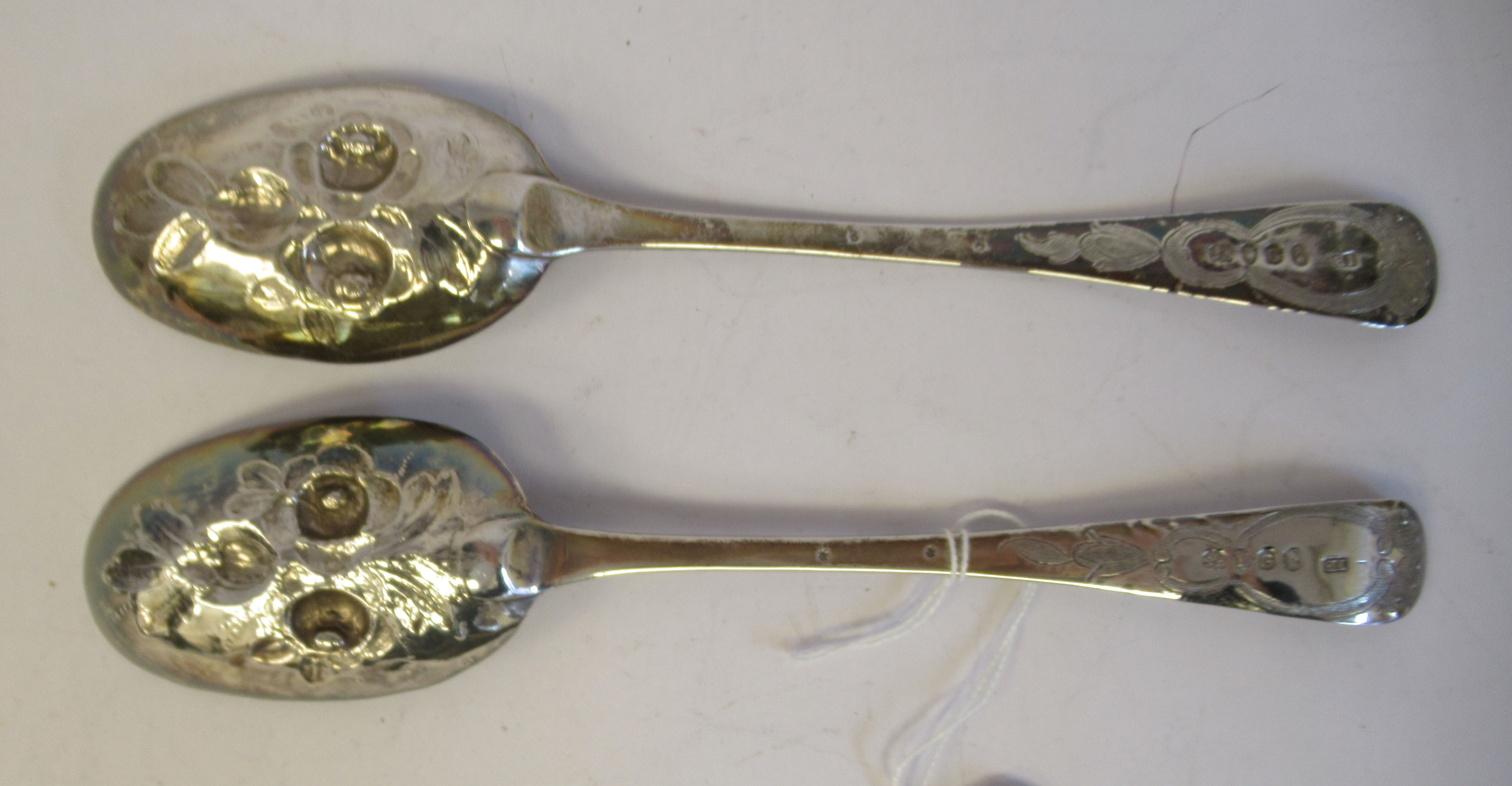 A pair of George III silver Old English pattern berry spoons with impressed, engraved and chased - Image 3 of 4