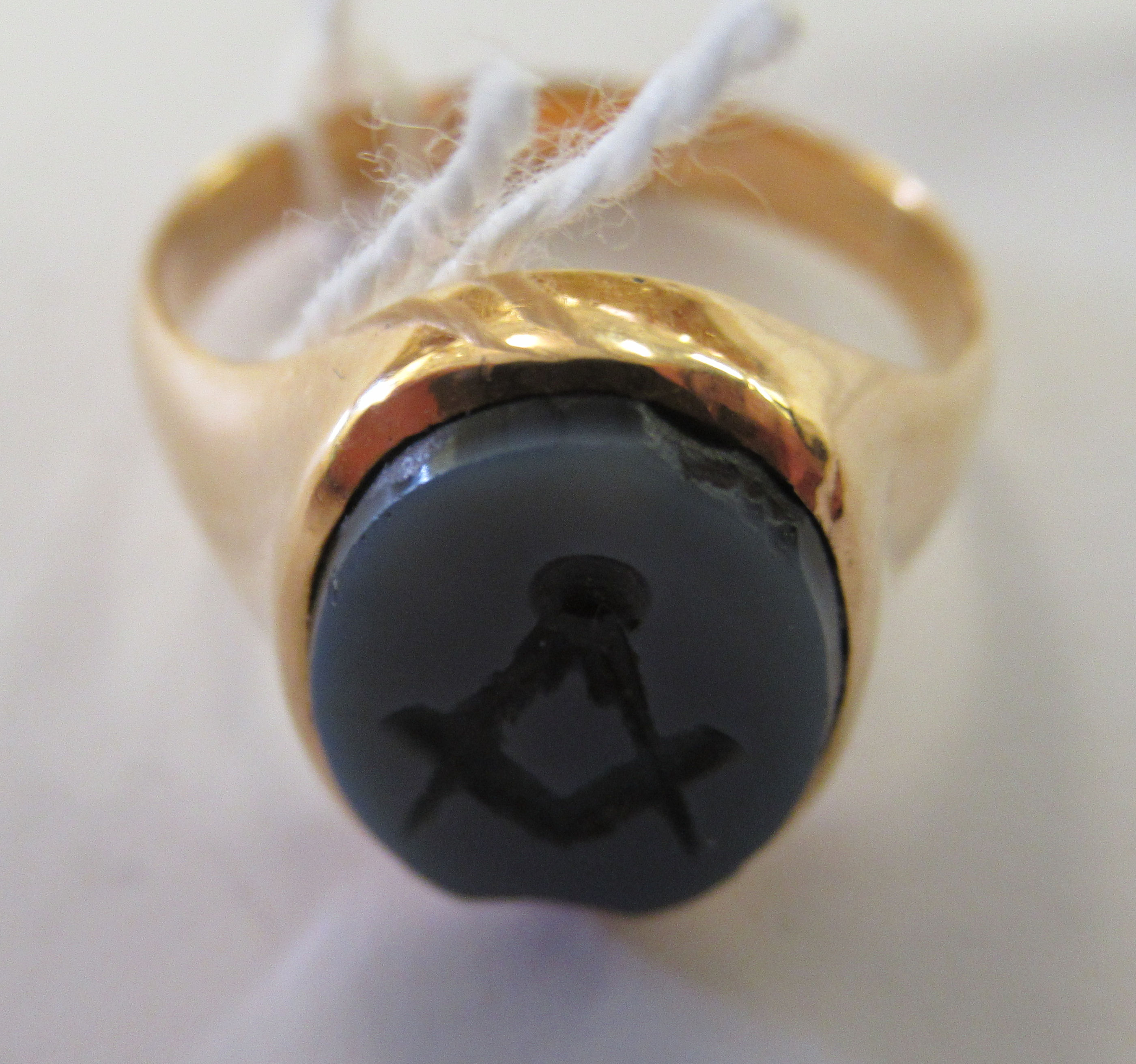 A yellow coloured metal Masonic ring