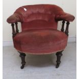 A Victorian horseshoe back, mahogany framed boudoir chair, part button upholstered in salmon pink