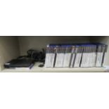 A Playstation 2; and a miscellany of games