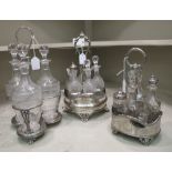 Two early/mid 20thC silver plated cruets with glass jars and a triform tantalus, containing three