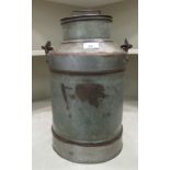 A galvanised metal milk churn with a folding top handle  17"h