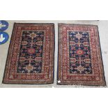 A Keshan carpet, decorated with dense floral motifs, on a blue ground  157" x 104"