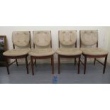 A set of four 1970s teak framed dining chairs, the part button upholstered, beige hide backs and