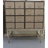 An HSLD Industrially inspired, twin bank, eight drawer filing cabinet, on a painted metal underframe