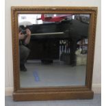 A late Victorian overmantel mirror, in a gilded gesso frame  31" x 27"