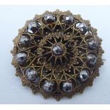 A vintage design brass brooch