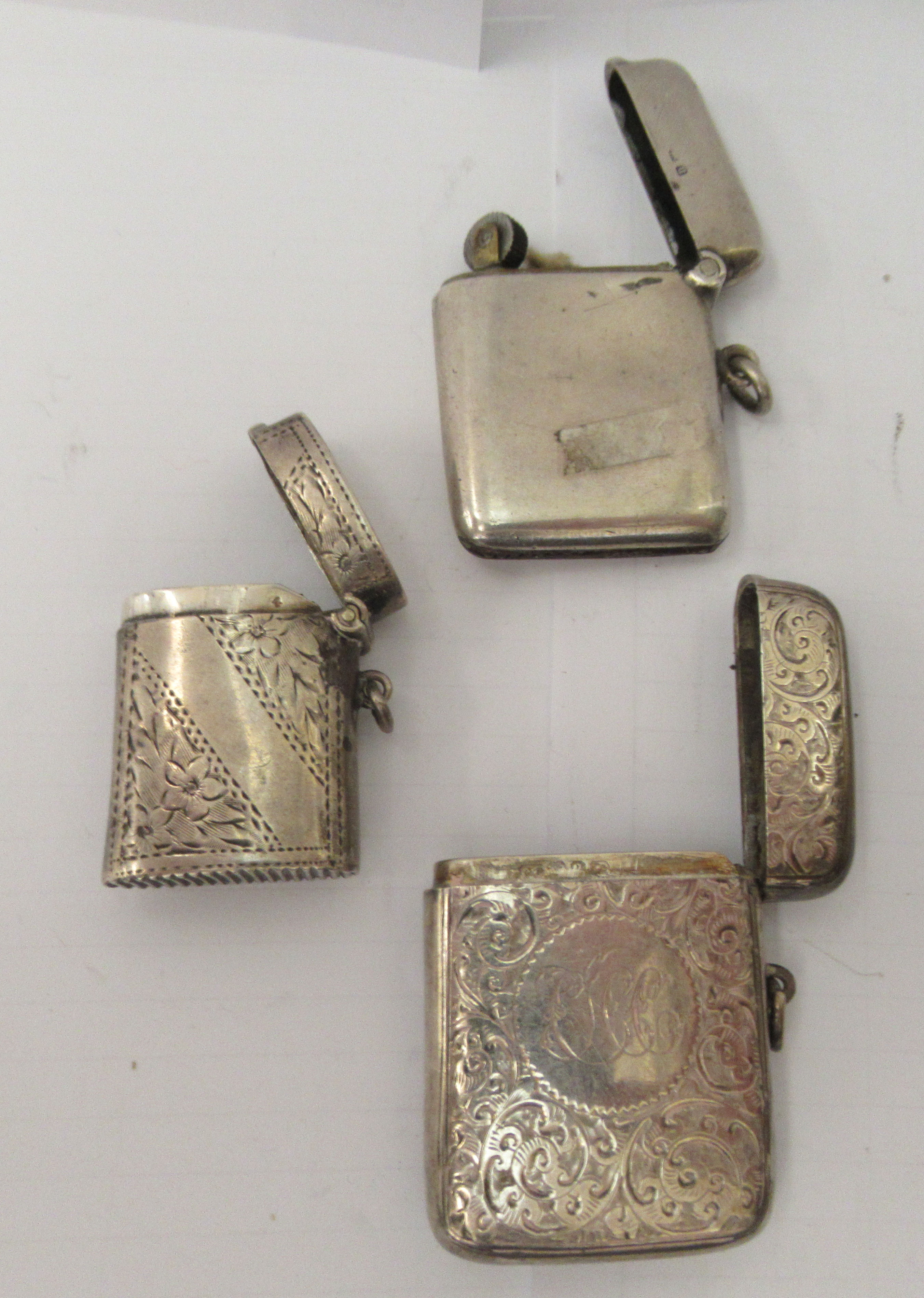 Three similar late 19th/early 20thC variously decorated silver vesta cases with strike plates, - Image 6 of 6