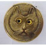 A modern novelty brass circular vesta case, featuring the head of a cat with glazed eyes