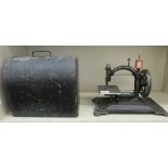 An early/mid 19thC National Express gilded cast iron manual sewing machine  bears a wax seal,