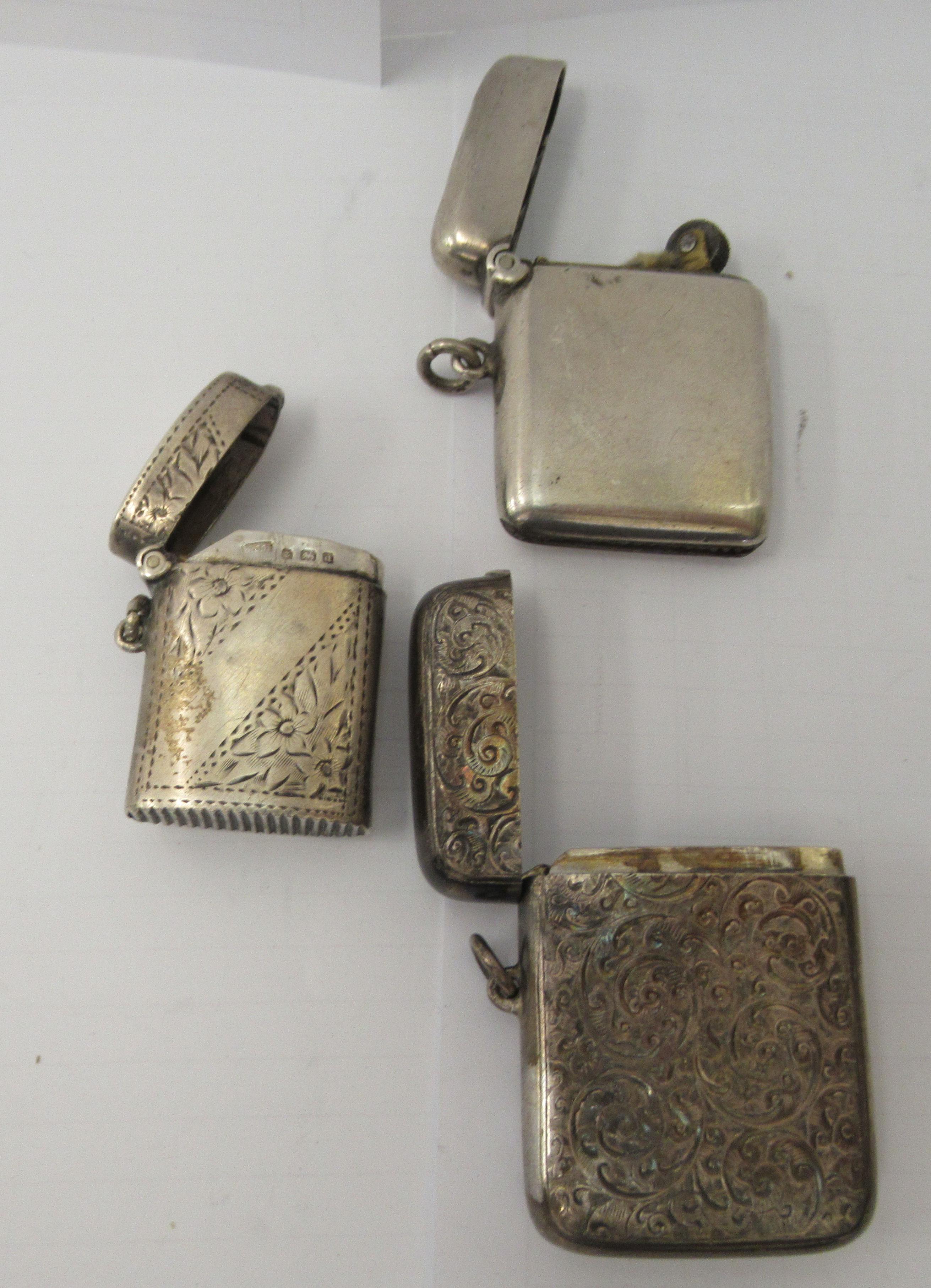 Three similar late 19th/early 20thC variously decorated silver vesta cases with strike plates, - Image 5 of 6
