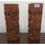 A pair of 20thC Chinese bamboo vases, carved in relief with landscape scenes  13"h