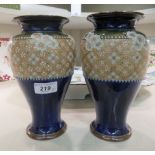 A pair of Royal Doulton stoneware vases, each with pressed lace decoration  8.5"h