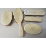 An gentleman's Edwardian set of five ivory back hairbrushes