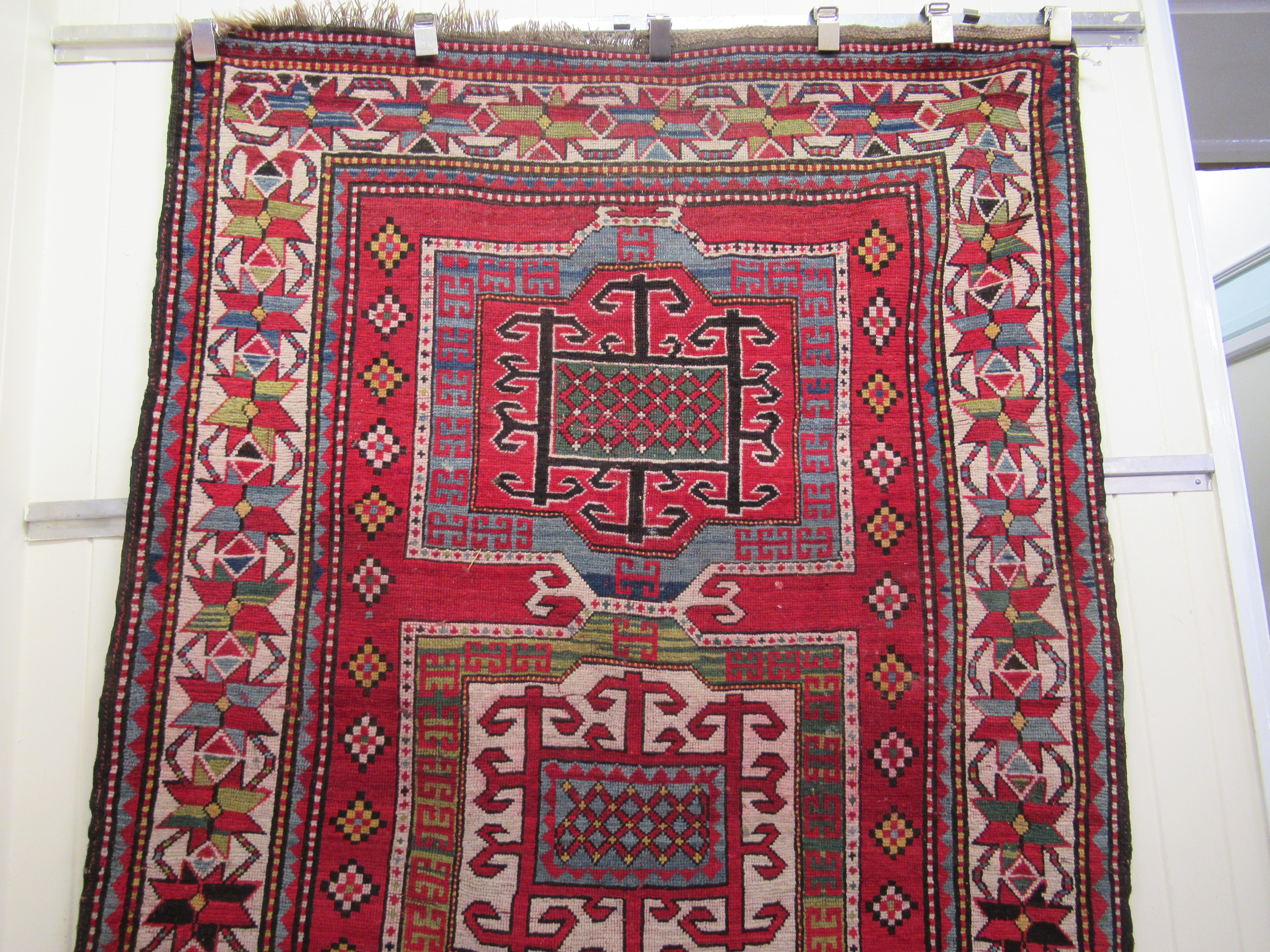 An Afghan Kazak rug, decorated with repeating geometric designs, on a cream ground  52" x 94" - Image 3 of 4
