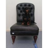 A Ralph Lauren Antique Range, aged, part button upholstered, black hide side chair, the