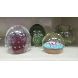 Four glass paperweights and dumps, each with internal bubbled ornament  largest 4.5"h